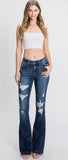 Distressed, mid rise, dark wash flared jeans