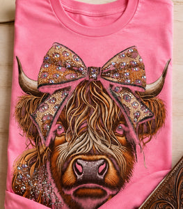 Highland cow rhinestone graphic tee in bright pink on model